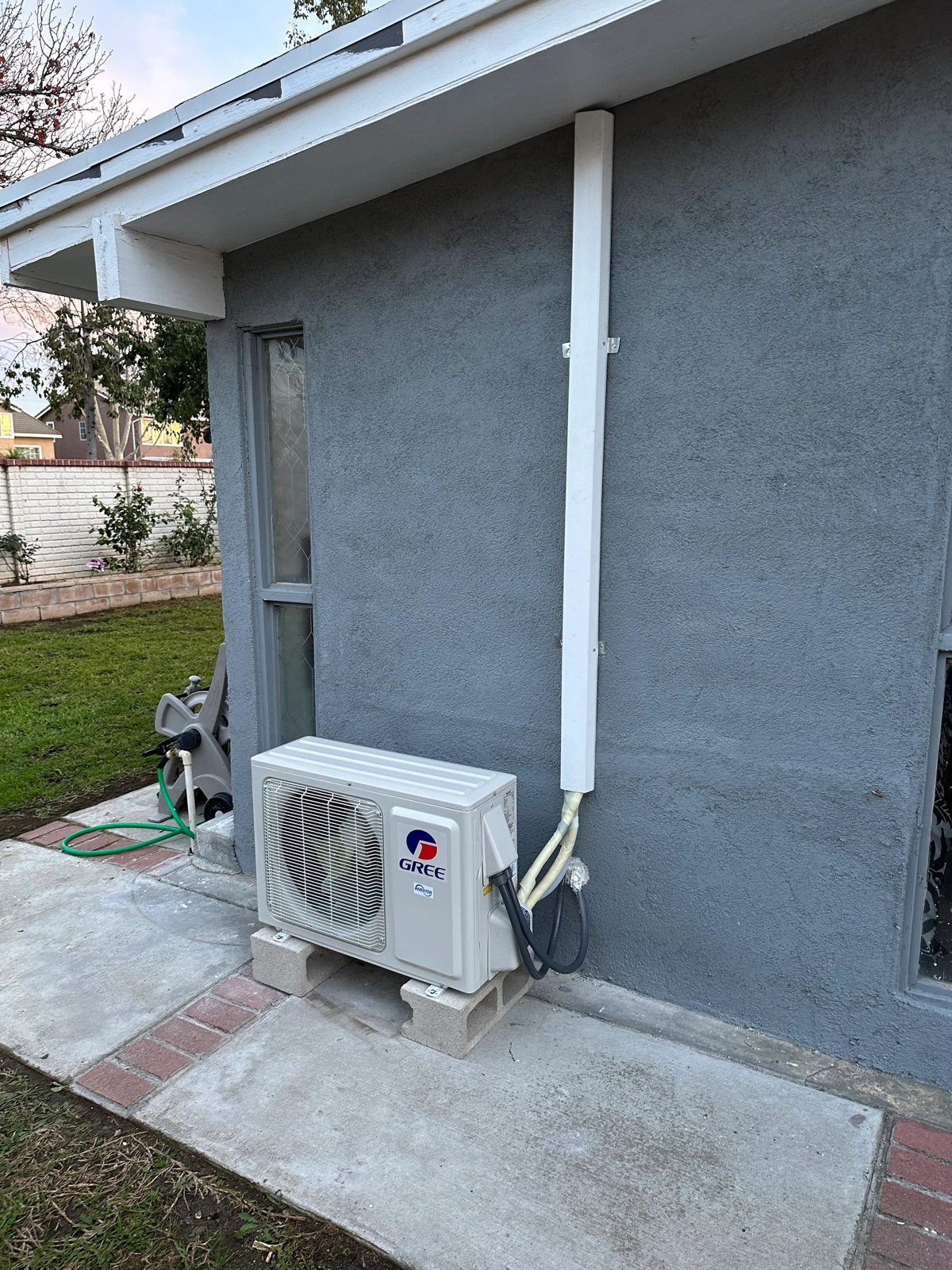 GREE 1 ton mini-split heat pump outdoor and indoor units installed