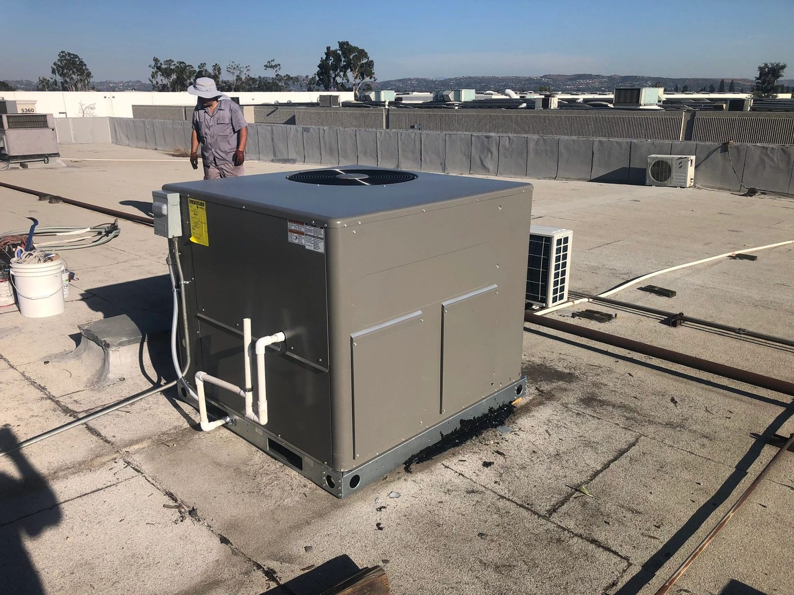 Lennox heat pump rooftop unit installed on a commercial roof