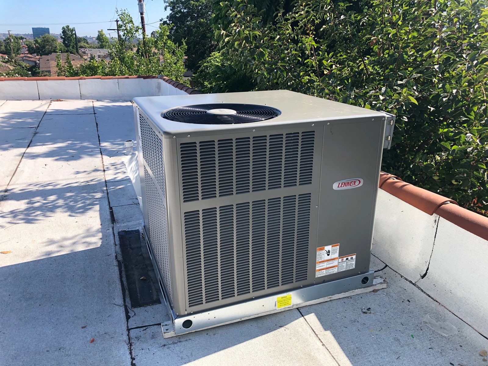 Lennox 3-ton heat pump roof unit installed on Southern California property