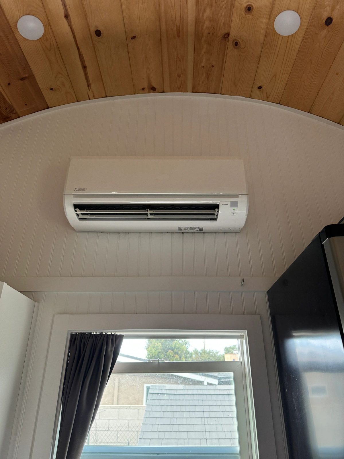 Mitsubishi mini-split indoor unit mounted on wall during installation