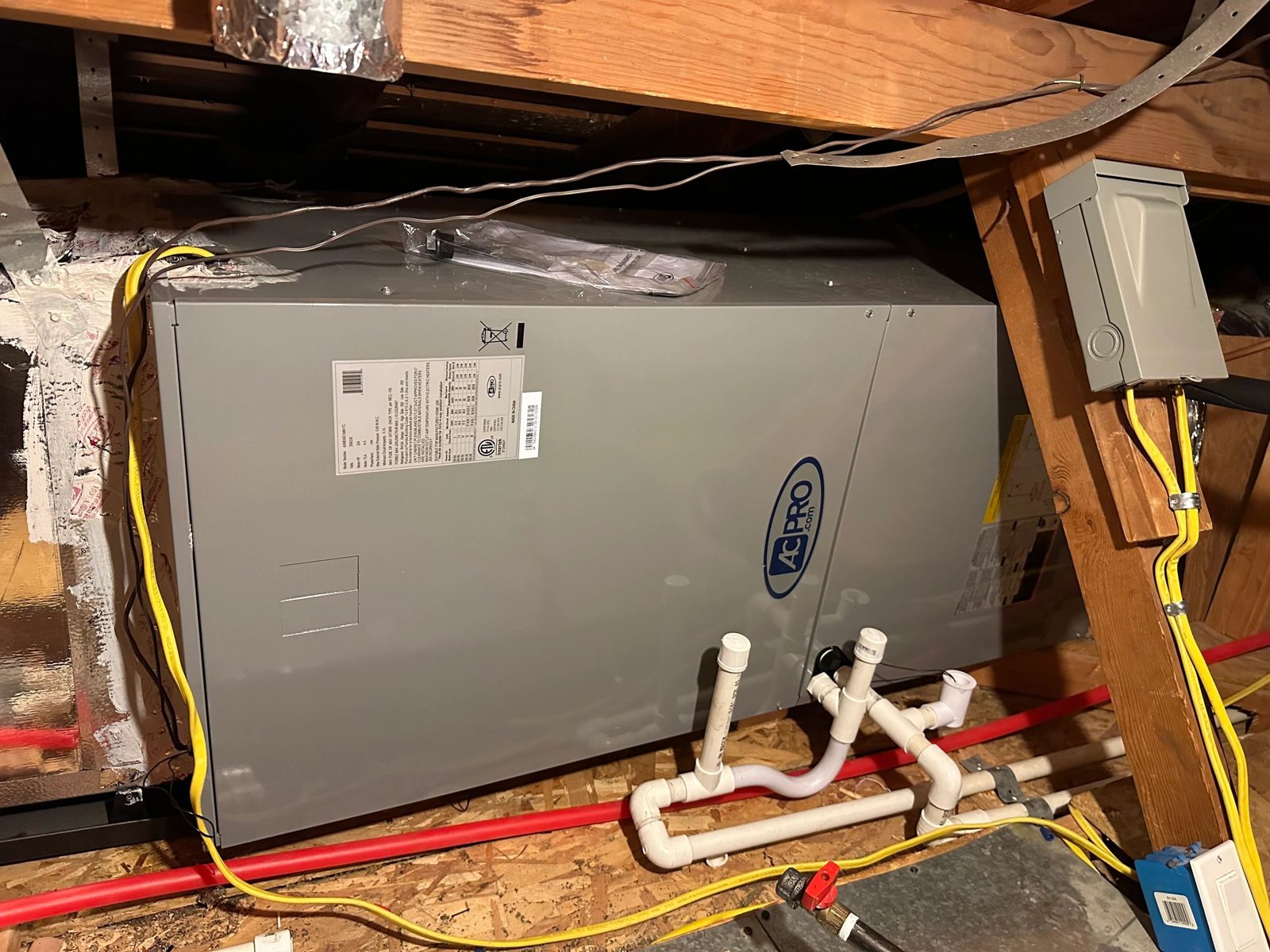 AC PRO X series heat pump outdoor unit installed in residential yard