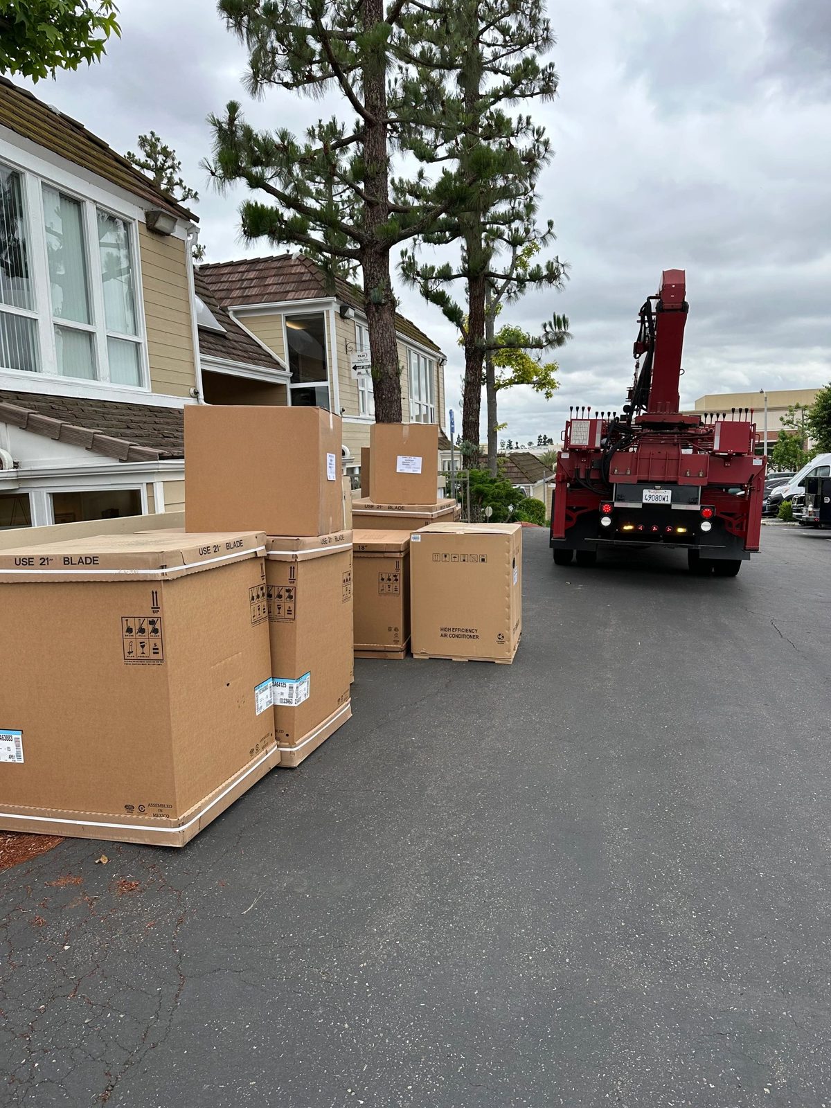 Technicians installing multiple AC systems at a Southern California home