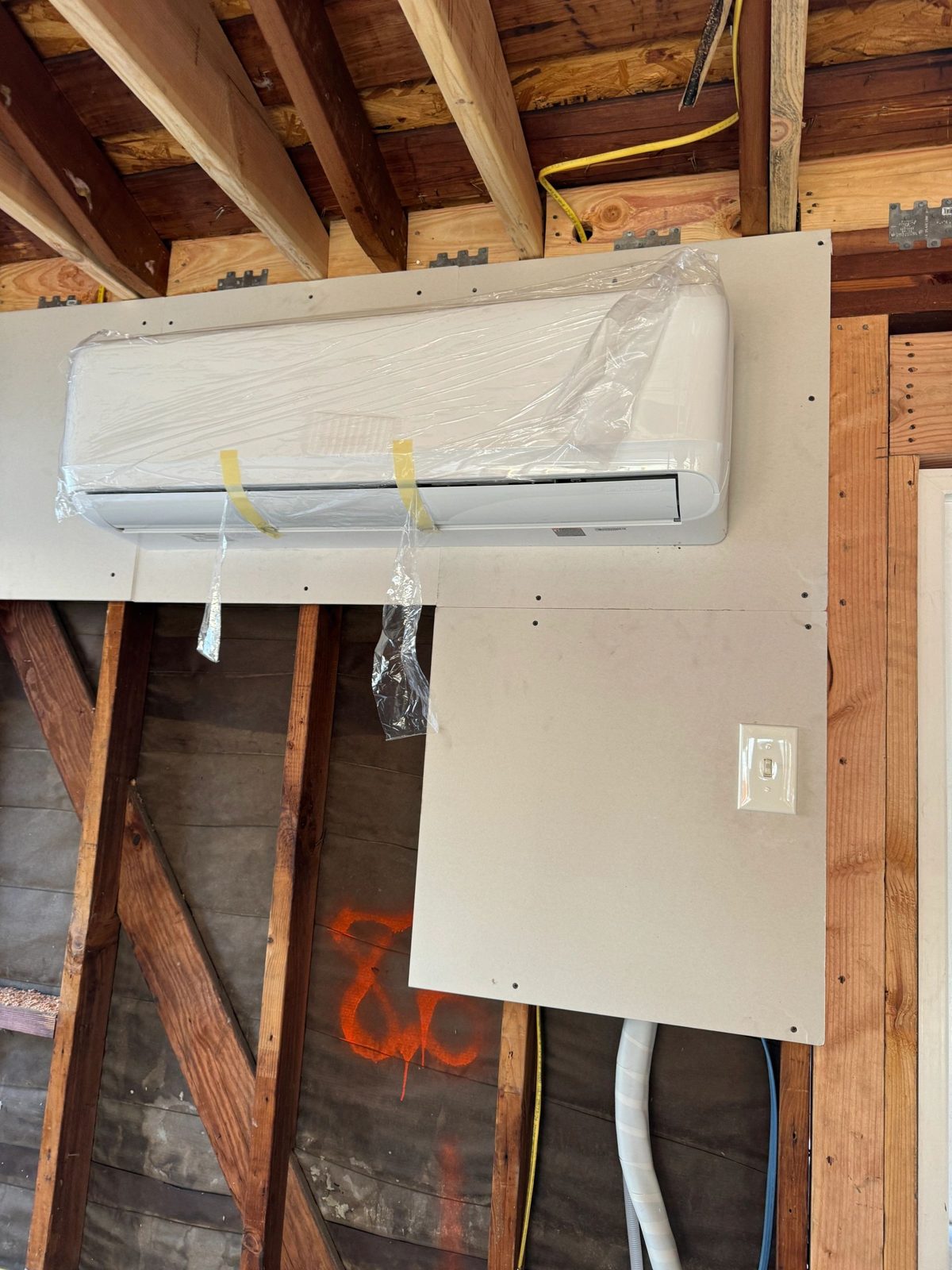 TOSOT 2-ton mini-split outdoor and indoor units installed in garage ADU