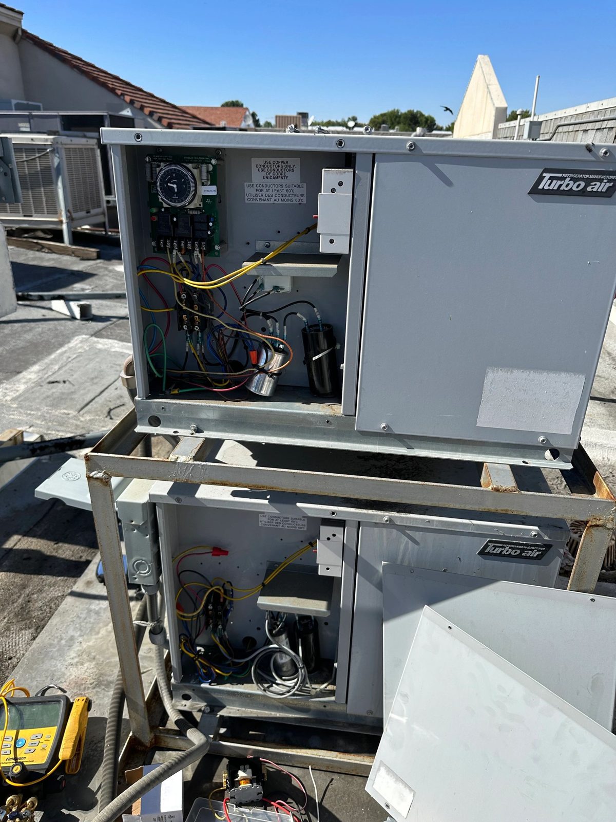 Technician working on walk-in freezer and cooler repair