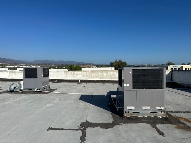 Install two 4-ton Heat Pump Package Units brand: Day & Night
