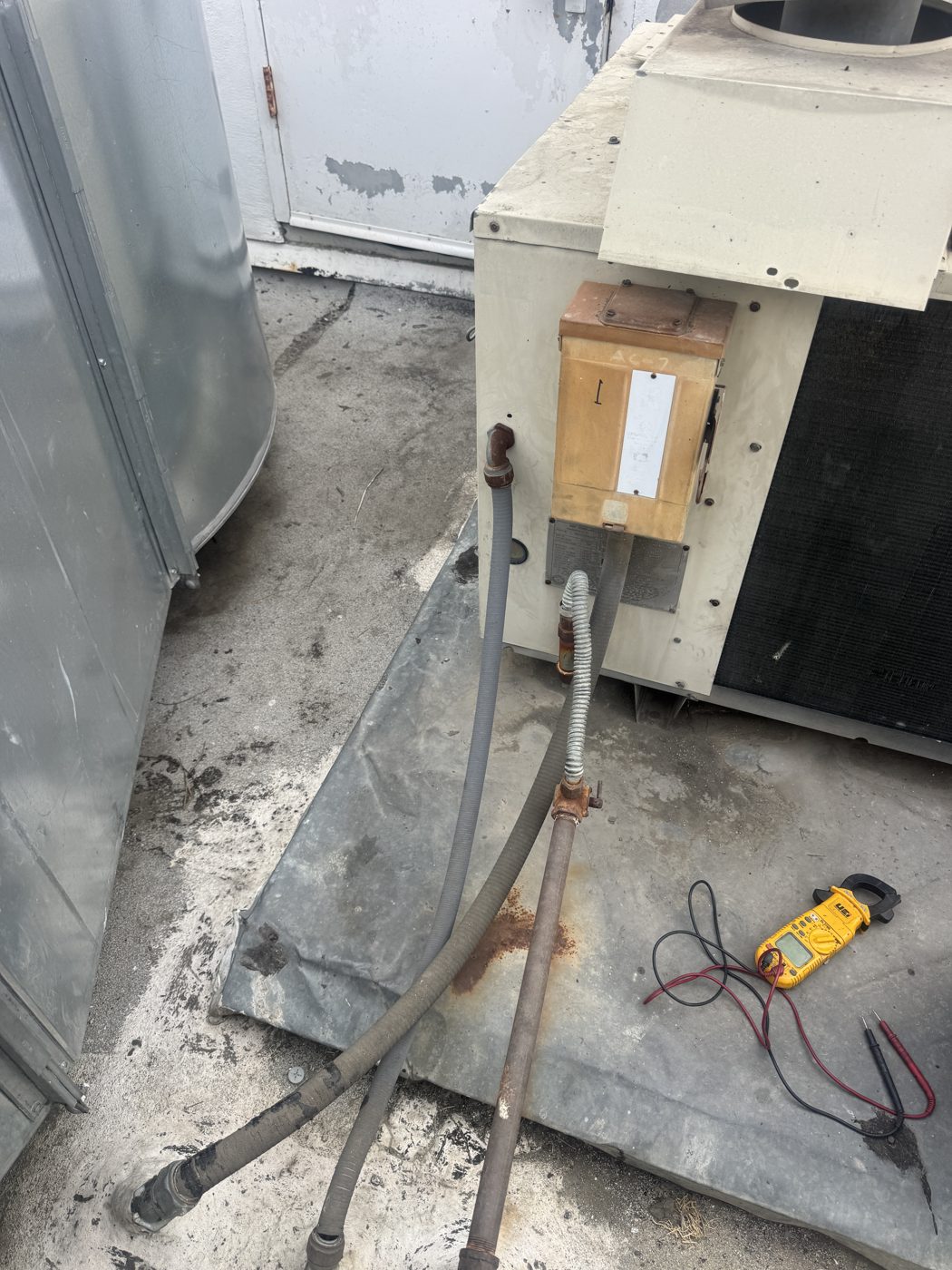 HVAC technician installing ductless mini-split on Chino Hills home wall