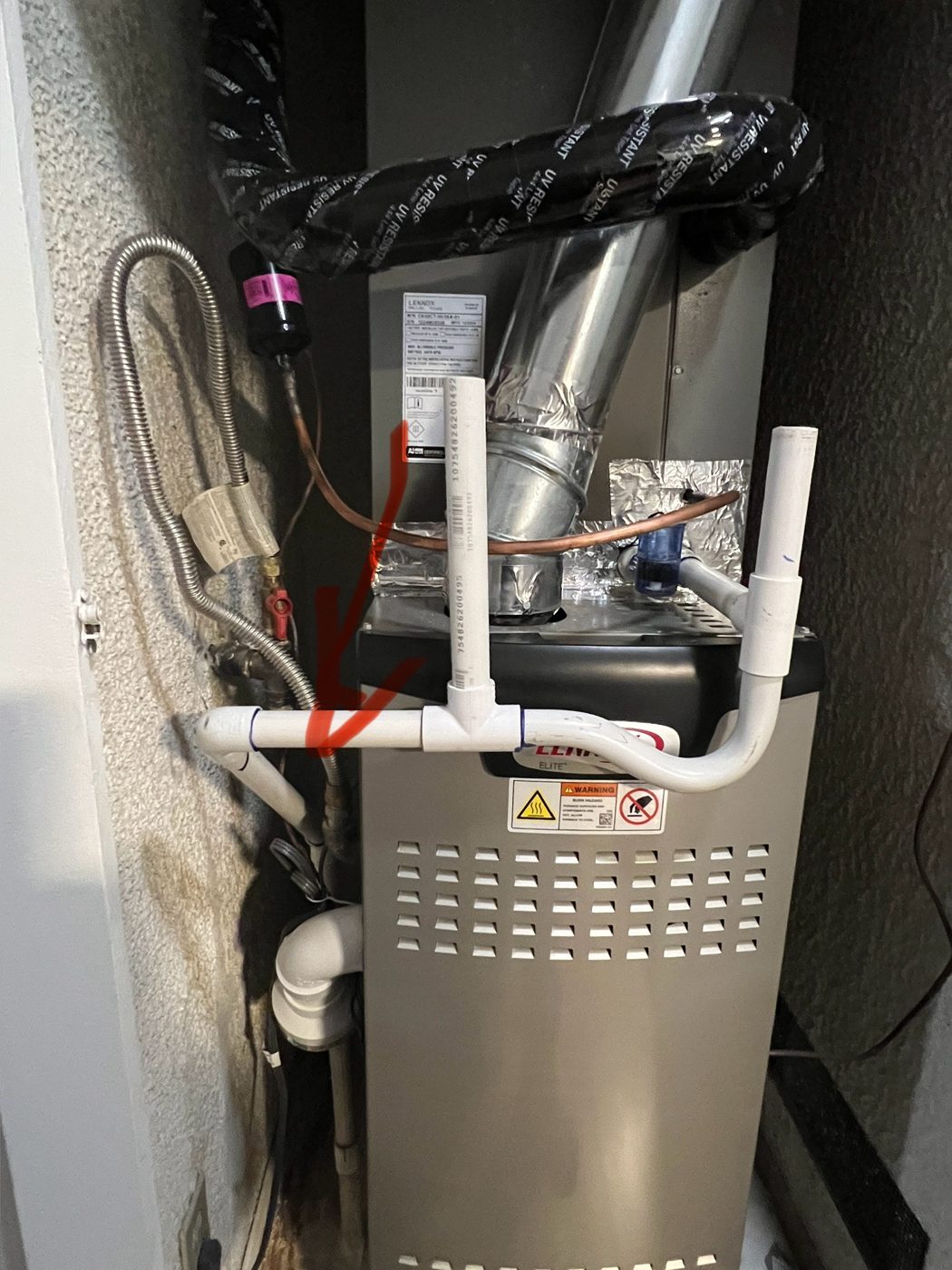 Technician installing a new energy-efficient HVAC unit in a Southern California home